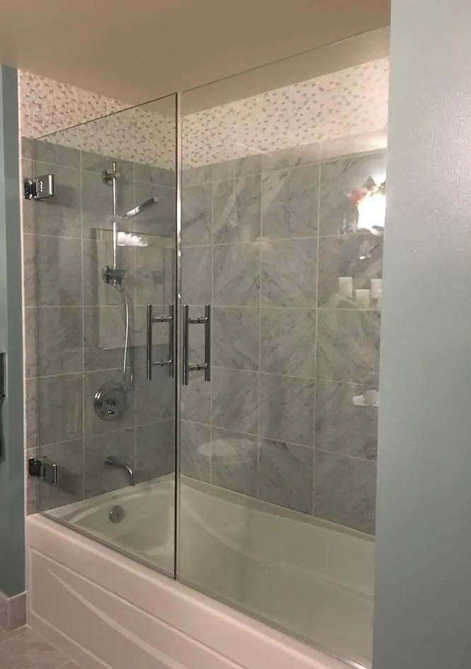Frameless shower door repair with marble bathroom